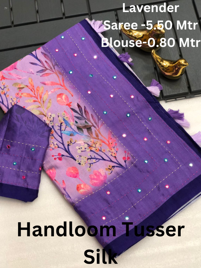 A handloom tussar silk saree with intricate mirror work and a zari border.