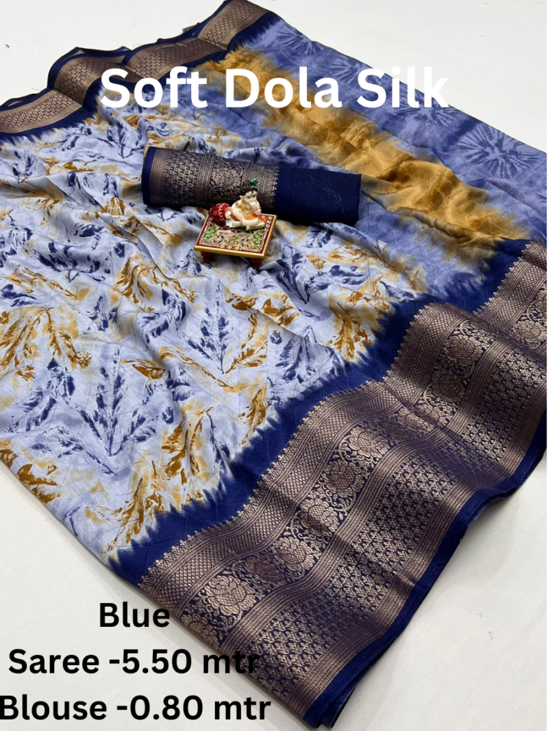 A Blue Soft Dola Silk Saree with a large, intricately woven border and a double shaded effect. The saree comes with a matching blouse piece.