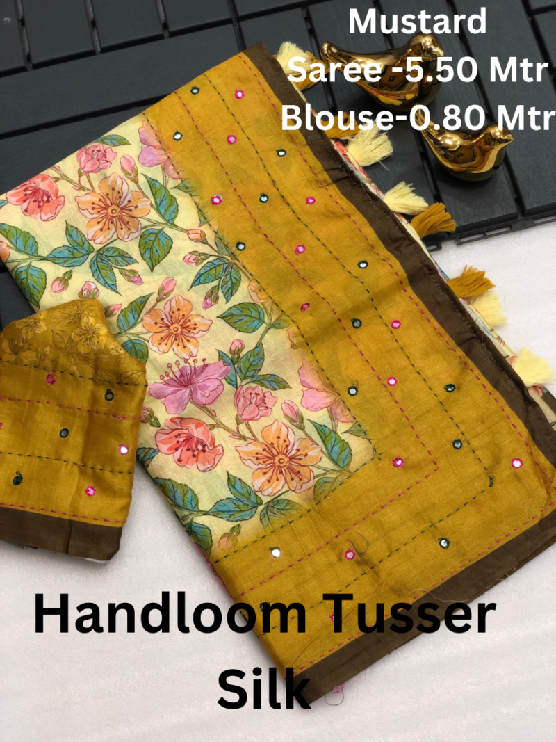 A handloom tussar silk saree with intricate mirror work and a zari border.