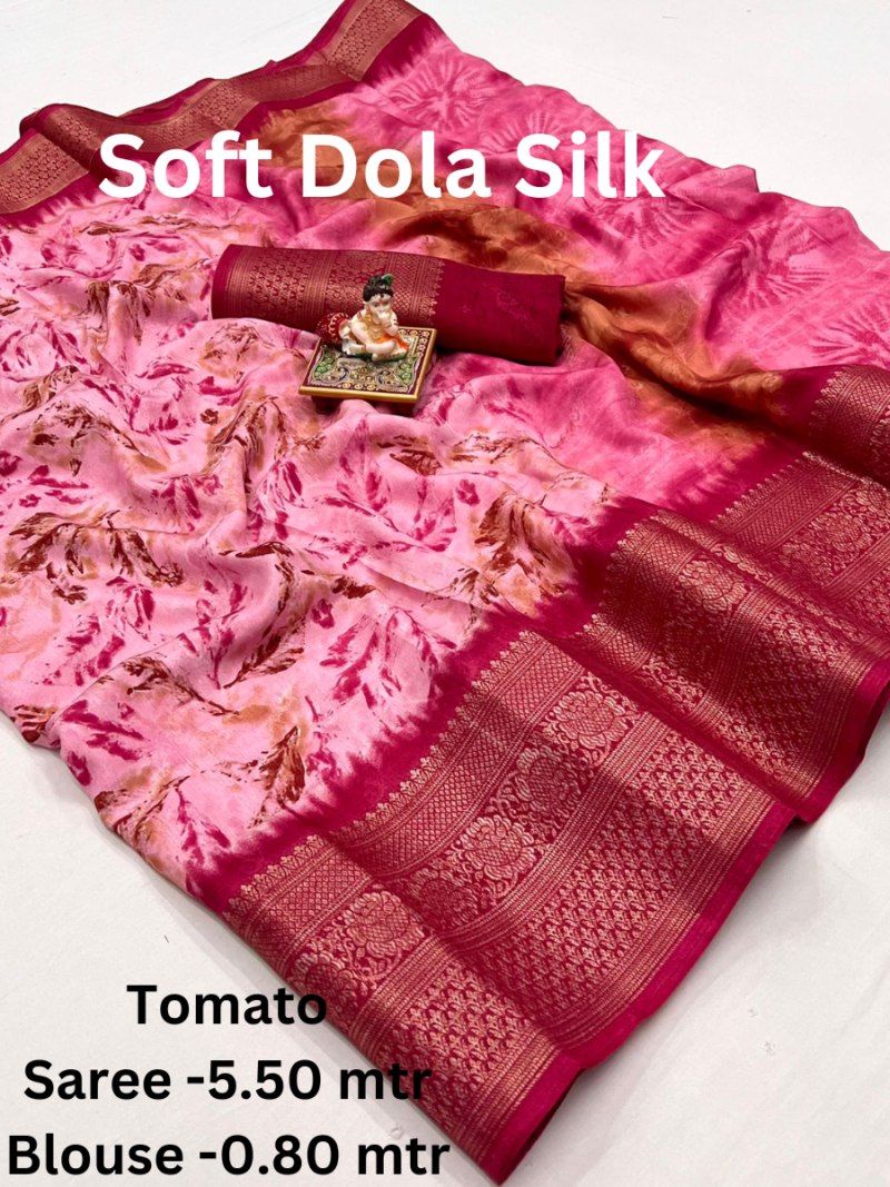 A red Soft Dola Silk Saree with a large, intricately woven border and a double shaded effect. The saree comes with a matching blouse piece.